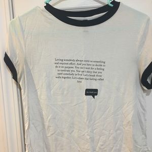 white and black quote shirt